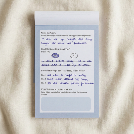 Guiding Koi Unwind Notepad interior page showing guided worry-processing prompts – CBT-inspired anxiety journal
