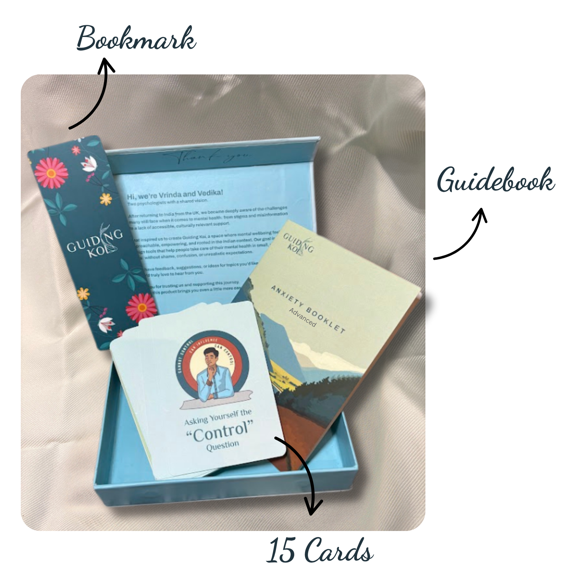 Open Guiding Koi Calm Deck Advance Edition box showing 15 illustrated mindfulness cards, a floral bookmark, and an Anxiety Booklet guidebook - all designed by psychologists to support emotional wellbeing.
