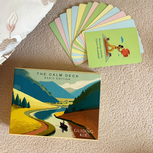 The Calm Deck by Guiding Koi displayed with colorful mindfulness cards spread out - a psychologist-designed tool to ease anxiety, stress, and overwhelm through simple daily practices.