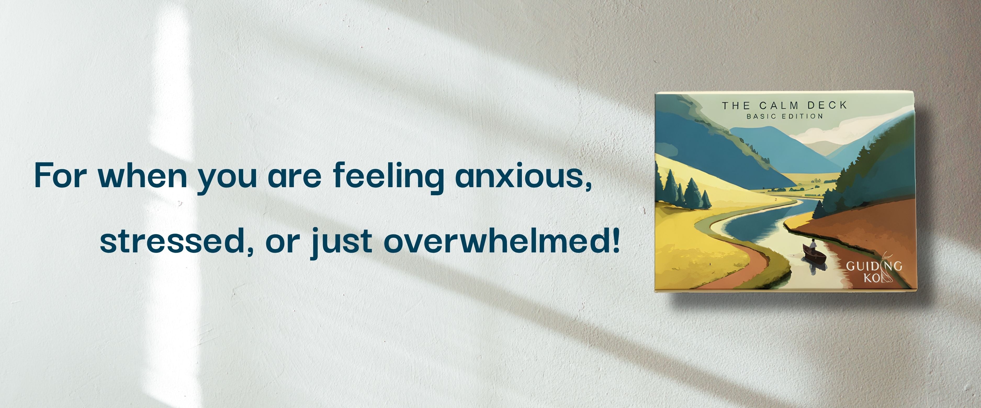 A Calm Deck product box  by Guiding Koi on a softly lit wall background, with text reading “For when you are feeling anxious, stressed, or just overwhelmed.
